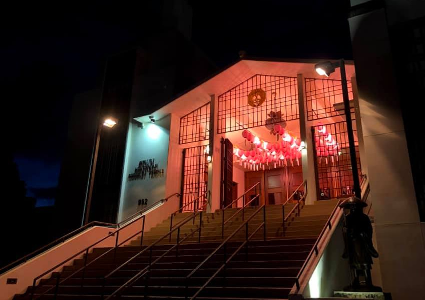 Temple at night with illuminated chochin lanterns